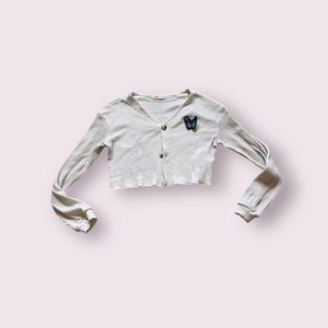 White button cardigan with blue butterfly patch